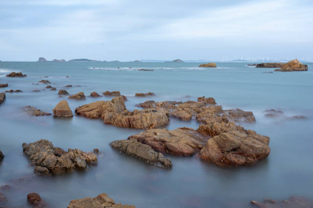 Long exposure of rocks on the coast in the evening