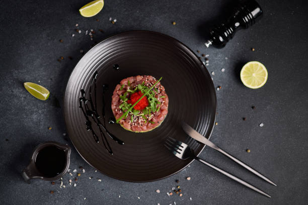 istock Tuna and avocado tartare on a dark ceramic plate 2153156074