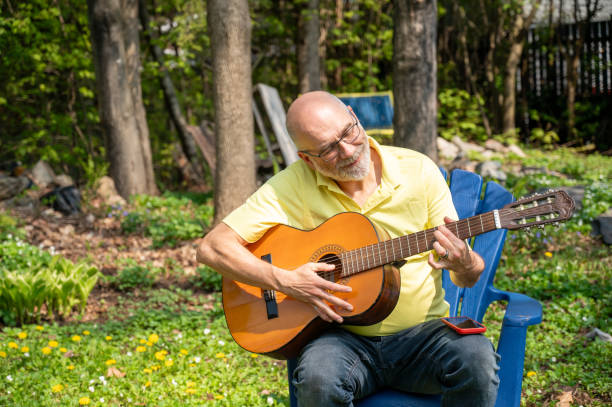 istock Mature man and guitar 2153156735