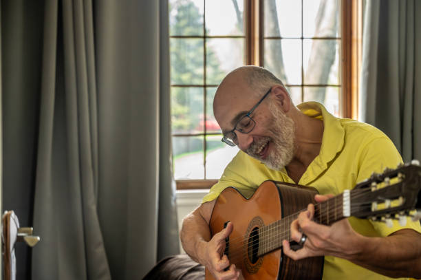 istock Mature man and guitar 2153156774