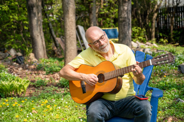 istock Mature man and guitar 2153156822
