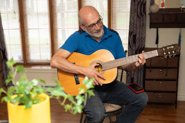 istock Mature man and guitar 2153156891