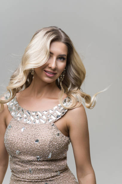 istock Beautiful woman posing against pale background 2153158446