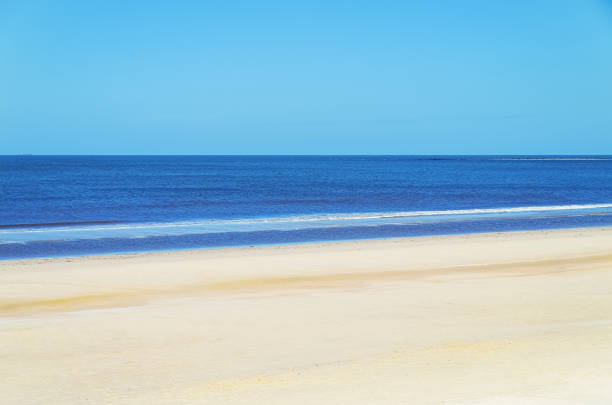 Summer vacation background, Beach Montevideo. blue sky, turquoise ocean water, white sand. Uruguay, South America. copy space.