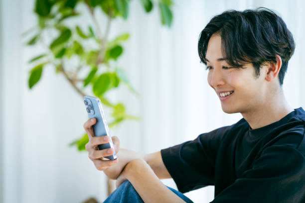 istock young man with mobile phone 2153160704