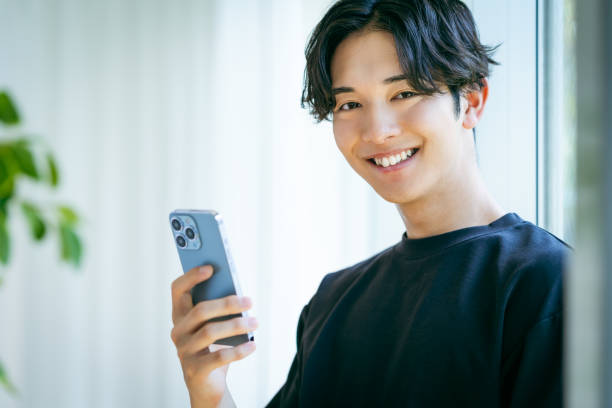 istock young man with mobile phone 2153160750