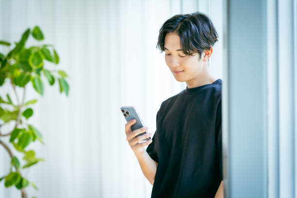 istock young man with mobile phone 2153160752
