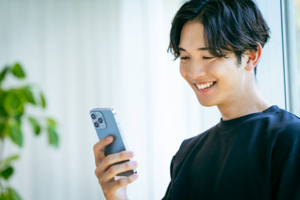 istock young man with mobile phone 2153160755