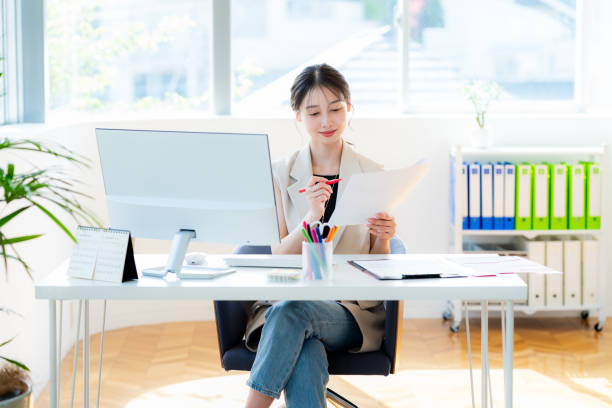 istock business woman working in the office 2153161926