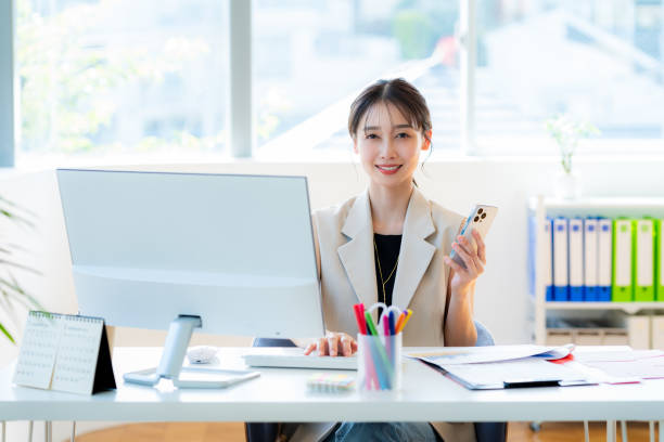 istock business woman working in the office 2153161939