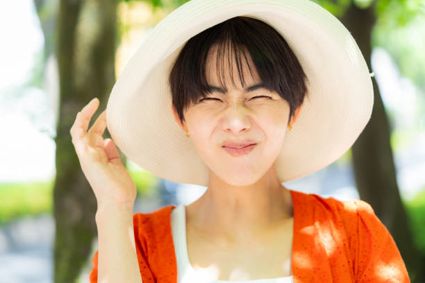 istock woman wearing a straw hat 2153163680