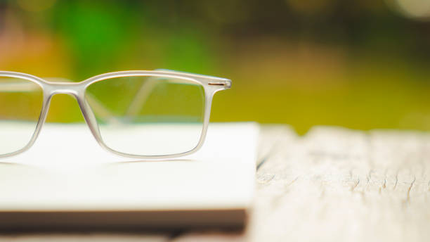istock Classic eye glasses on white notebook, idea, innovation and inspiration concepts. 2153164277
