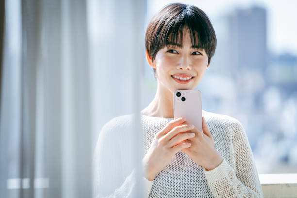 istock young woman with mobile phone 2153167422