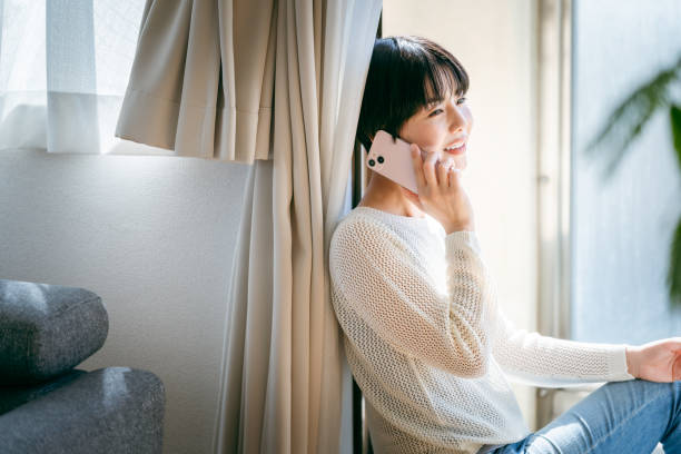 istock young woman with mobile phone 2153167448