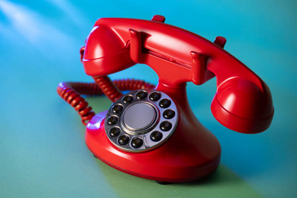 istock Retro red telephone on blue green background 2153167956