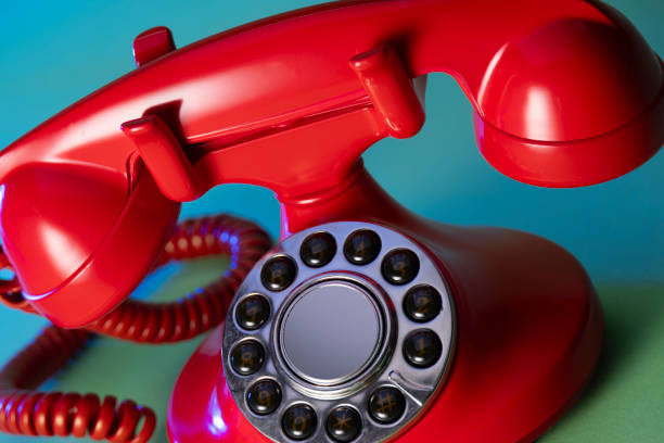 istock Retro red telephone on blue green background 2153167957