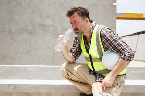 Male worker working in a very hot day.