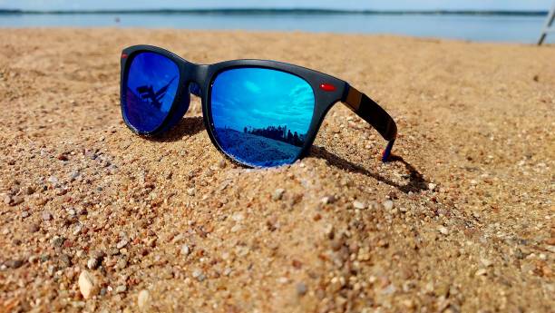 istock sunglasses on the beach 2153173449