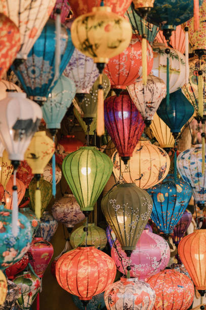 Colorful paper lanterns hanging from the ceiling. The lanterns have various designs and colors.