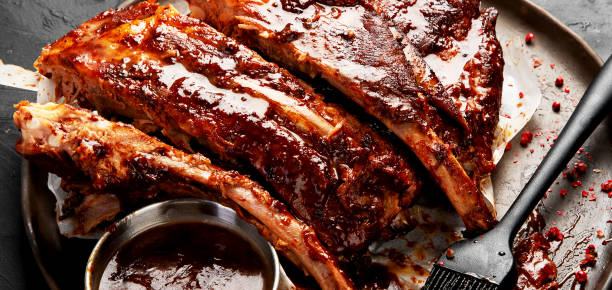 Grilled and smoked ribs with barbeque sauce.
