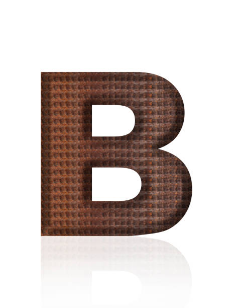 Close-up of three-dimensional rusty rebar alphabet letter B on white background.