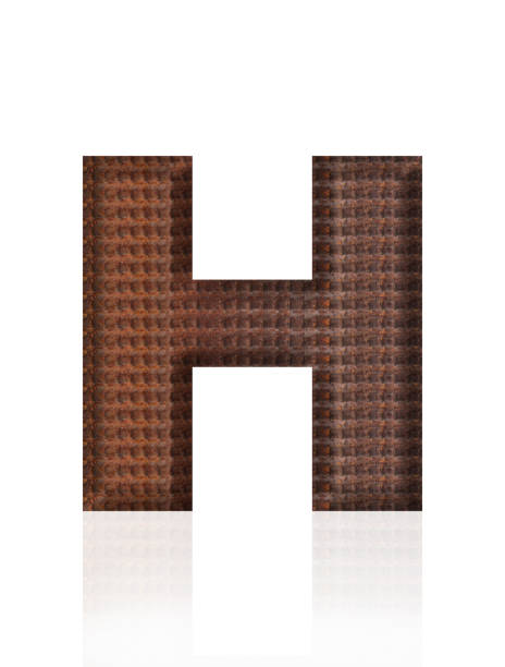 Close-up of three-dimensional rusty rebar alphabet letter H on white background.