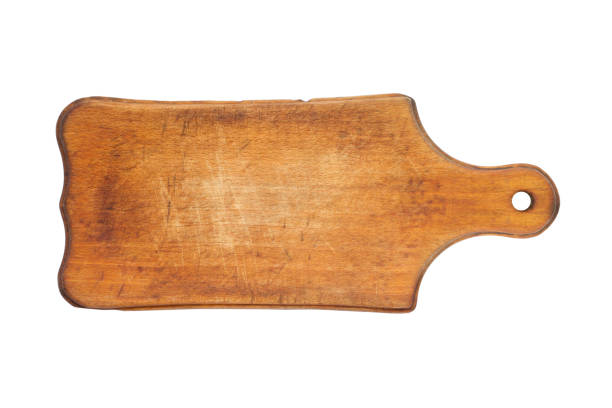 Antique wooden cutting board on a white background. The old cutting board is isolated.