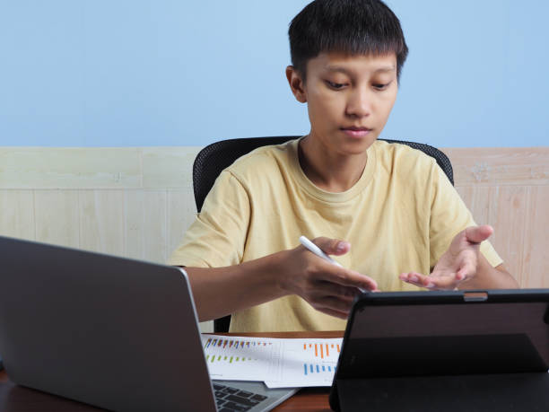 istock Young Asian businessman working from home 2153179234