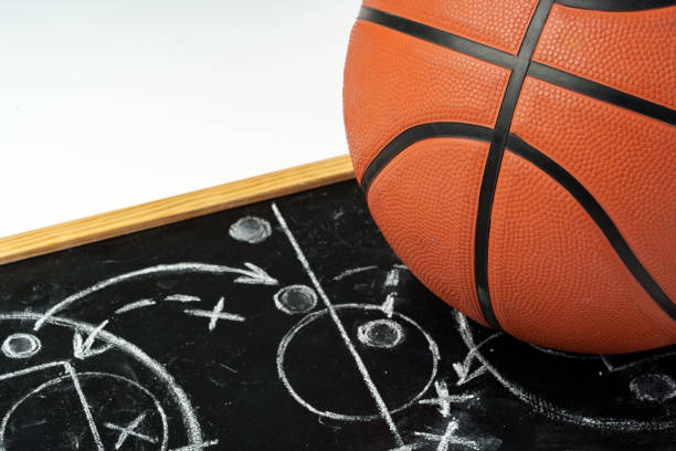 istock Basketball ball with chalkboard strategy planning close up 2153179369