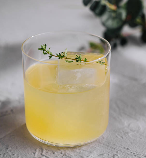 istock Refreshing herbal cocktail on minimalist background 2153184375