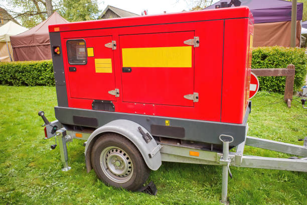 istock Modern emergency backup power generator with diesel engine on a portable trailer. Industrial mobile diesel generator connected to the electrical network by cable. 2153184642