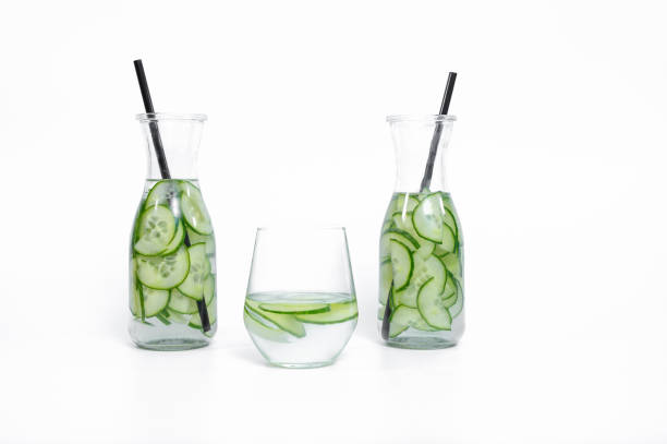 istock Water with sliced ​​cucumber in a transparent glass on a white background 2153184863