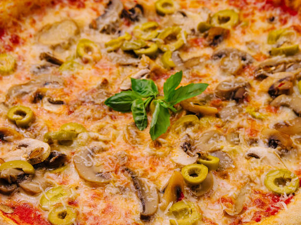 istock Freshly baked mushroom and olive pizza 2153185221