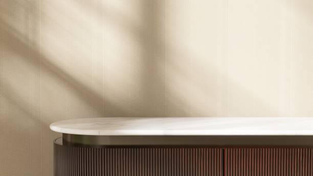 istock Minimal wooden counter table, white marble countertop, in sunlight, shadow on brown wall 2153187779