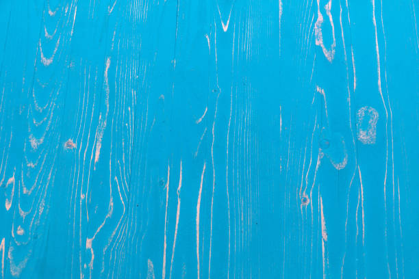 Wooden boards painted with blue paint as an abstract background.