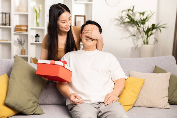 istock Surprise Gift Exchange Between Friends at Home 2153190755