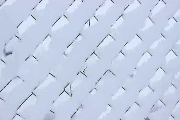 Background from a snow fence. Winter garden