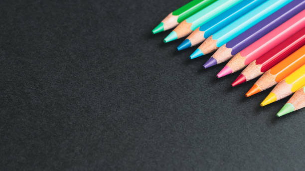 istock Colorful colored pencils on black background, with copy space. 2153192762