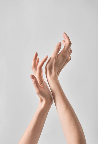 istock Two Hands Reaching Up. With clean skin 2153192801