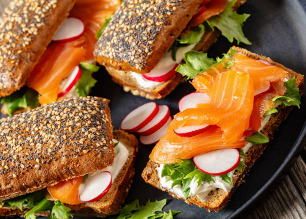 istock smoked salmon sandwiches on rye bread rolls 2153192892
