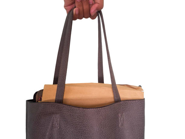 istock Holding a Bag Goes to Business 2153193016