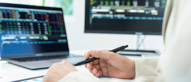 istock Business women calculate benefit, spreadsheets, graph financial development, bank accounts, statistics, economy, data analysis, investment analysis, stock exchange,Interest rates, income 2153193528