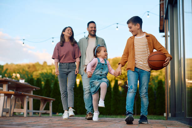 istock Happy kids having fun during family day int he backyard. 2153193767