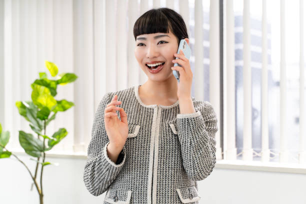 istock Female secretary using a smartphone 2153197885