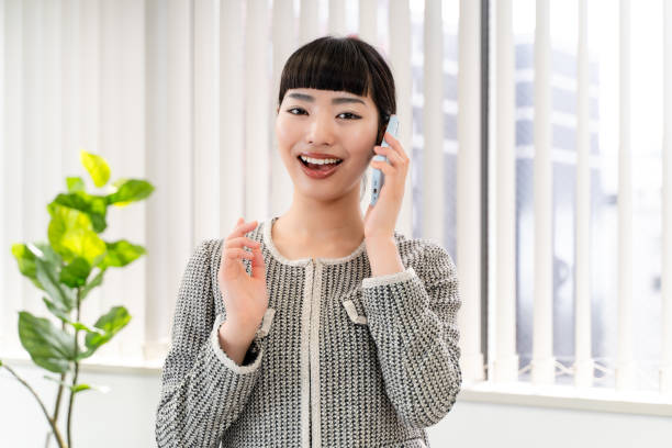 istock Female secretary using a smartphone 2153198972