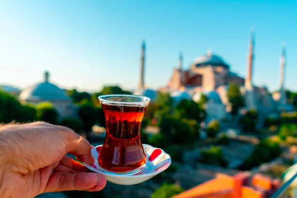 istock A man drinks Turkish tea opposite the Hagia Sophia Mosque. The man drinks his tea while admiring the view. Istanbul Turkey. 2153200654