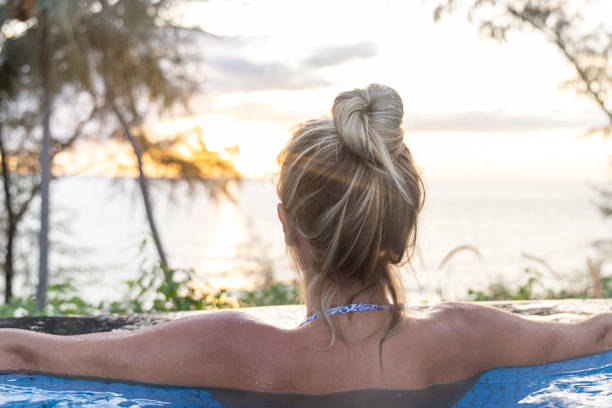 istock A Young Woman Relaxing in Infinity Pool 2153200729