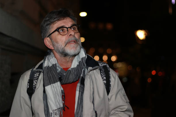 istock Mature man in city night wait transportation 2153212955