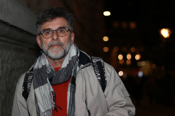 istock Mature man in city night wait transportation 2153212962