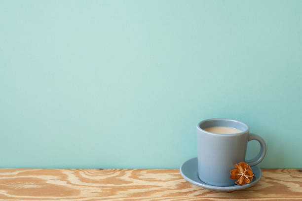 istock Cup of latte coffee on wooden table. mint wall background 2153218987